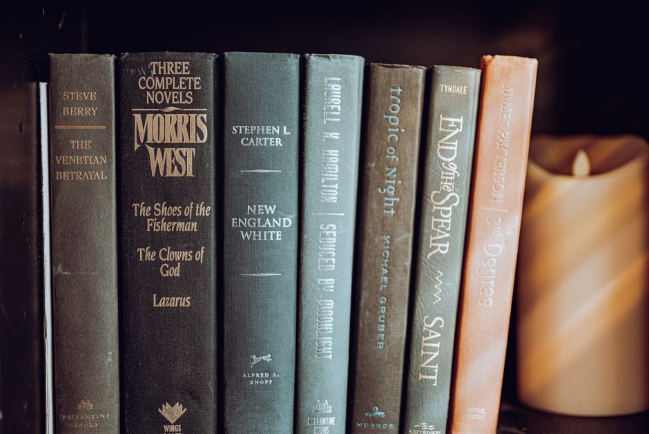 Vibrant array of books on shelves inside a bookstore, showcasing literature diversity.